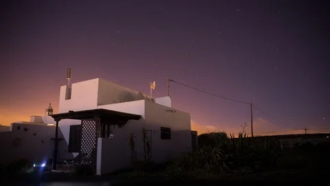 Night sky astro timelapse in front of a white traditional house in Lanzarote 4K Stock Footage 89147819