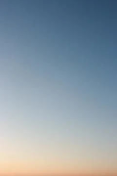 Night sky as background or gradient. Clear evening sky without clouds. Stock Photos