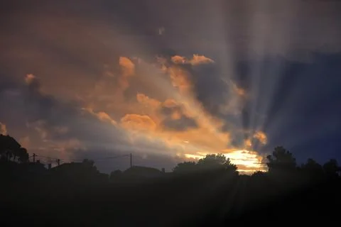 Night sky with clouds and rays of light Stock Photos