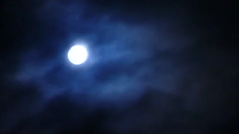 Night sky with the full Moon behind dark clouds, nebulous mysterious midnight Stock Footage 167809793