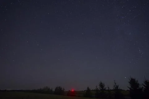 Night sky full of stars with a comet Stock Photos