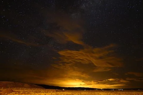 Night sky with illuminated clouds over the city of La Paz Tiwanaku Department Stock Photos