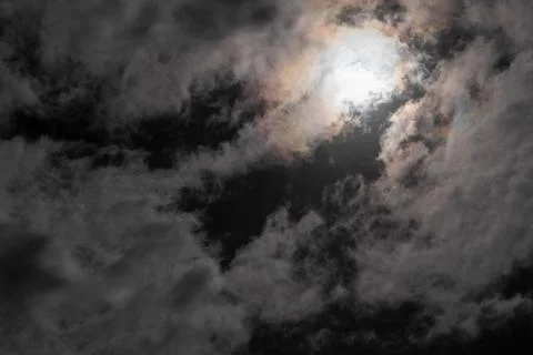 Night sky with moon behind clouds Foto stock