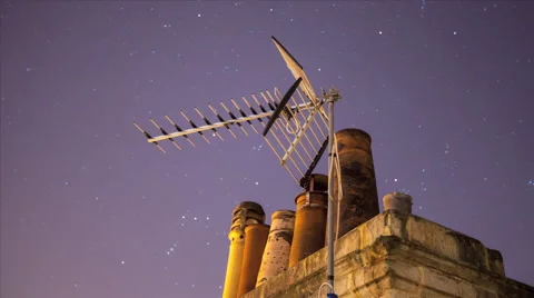 Night sky star timelapse withchimney pots and television aerial Stock Footage 47013423