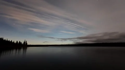 Night sky time lapse at a large calm northern lake.  Stock Footage 276123657