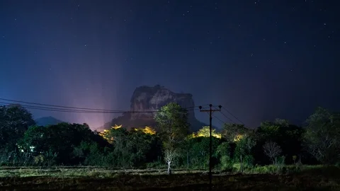 Night sky time lapse over Sigiriya rock in Sri Lanka Stock Footage 106470723