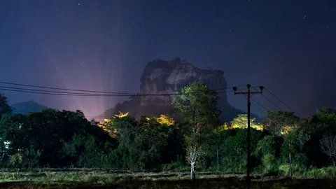 Night sky time lapse over Sigiriya rock in Sri Lanka Stock Footage 106473139