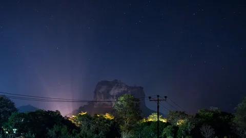 Night sky time lapse over Sigiriya rock in Sri Lanka Stock Footage 106487917