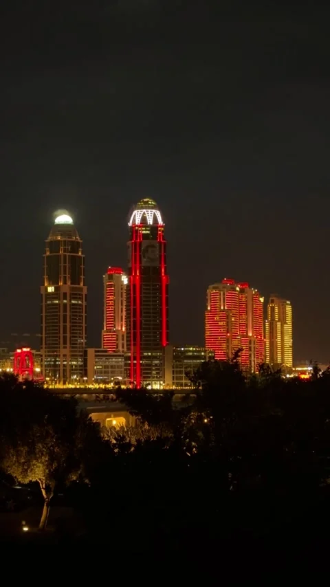 Night skyline of Doha featuring illuminated modern skyscrapers Stock Footage 325897872