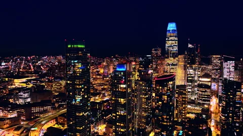 Night skyline with illuminated tower over downtown grid, San Francisco Stock Footage 337462694