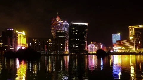 Night Skyline of Macau with reflections of Lisboa Casino at thef Nam Van Lake Stock Footage 82854909