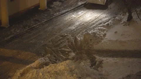 Night Snow loading by road machinery after heavy snowfall in residential bloc Stock Footage 86982863