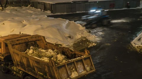 Night Snow loading by road machinery after heavy snowfall in residential bloc Stock Footage 102137095