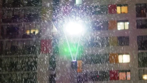 Night snowfall in light of lantern Stock Footage 82515923