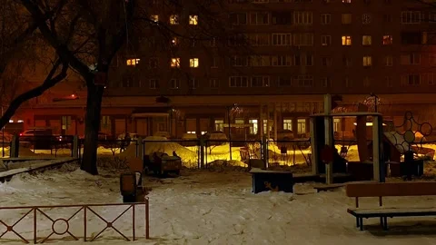 Night snowfall, under the light of lanterns Stock Footage 260992660