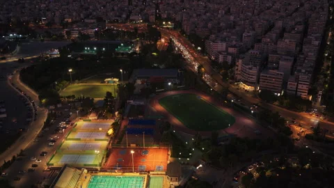 Night sports complex turning off lights aerial view Stock Footage 342290894