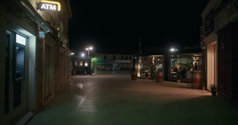 Night square with restaurants and ATM sign in Primosten Video stock 336840845