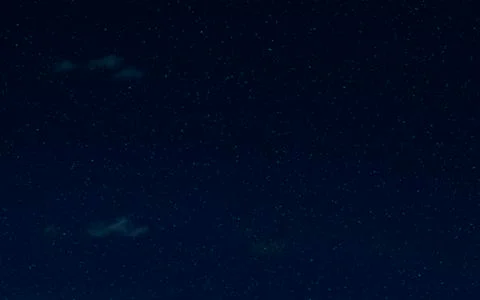 Night starry sky and clouds. Moonlight dark background and stars in the sky. Stock Photos