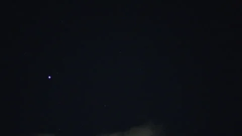 Night starry sky with stars and airy thin clouds passing in through the frame Stock Footage 329068503