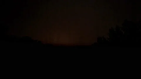 Night storm timelapse, dark sky with lightnings over forest. Stock Footage 200196282