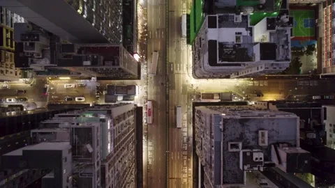 Night street intersection illumination in a rainy and cloudy famous Kowloon Stock Footage 331135286