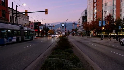 Night street scene of trendy Mt Pleasant East Vancouver neighbourhood Stock Footage