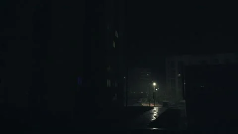 Night, strong wind, lightning rain, street lamp, a car passes on the road. Stock Footage 201427347