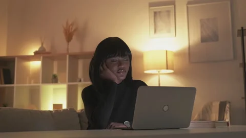 Night study online learning tired woman laptop Stock Footage 201511737