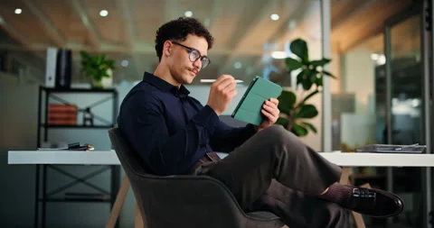 Night, stylus or man with tablet in office, proofreading story or fact check for Video stock 323315576