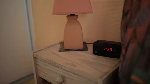 Night Table Lamp and Digital Alarm Clock Stock Footage 99837033