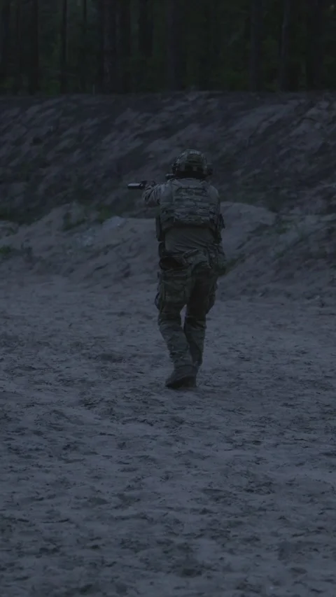 Night tactical training session of soldiers at outdoor firing range Stock Footage 333612760