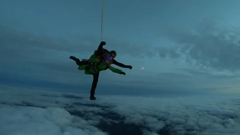 Night tandem jump Stock Footage 117411707