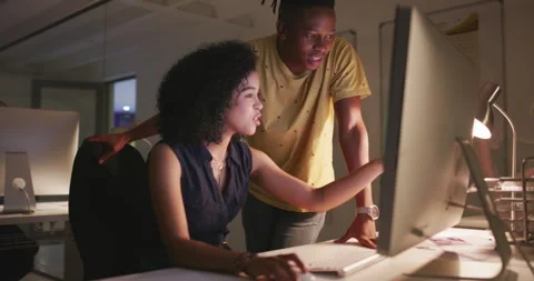 Night, team or help with computer in office for training, campaign improvement Stock Footage 348764434