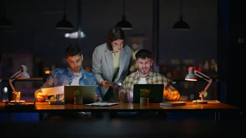 Night teammates having deadline working computers at modern workspace closeup Stock Footage 339299742