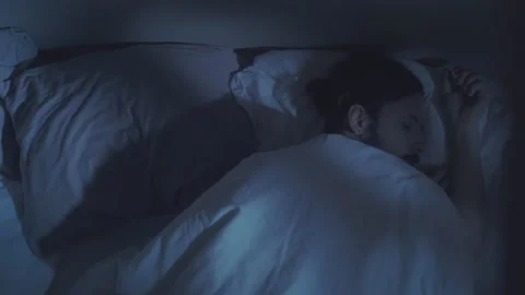 Night terror trouble sleeping disturbed man in bed Video stock 154034066