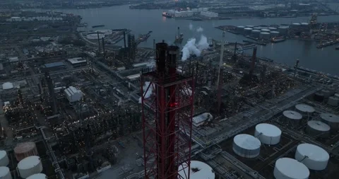 Night time aerial, smoke stack at a refinery in the port of Antwerp, Belgium Stock Footage 270970722