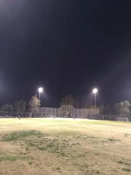 Night time baseball game at playing field outdoor Stock Photos