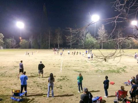 Night time baseball game at playing field outdoor Stock Photos