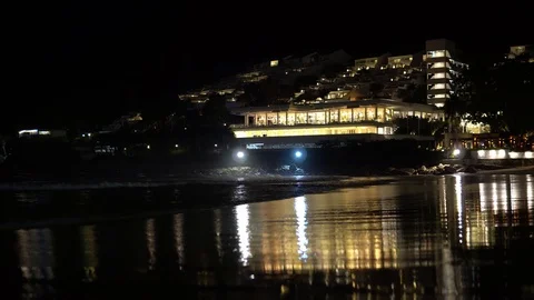 Night time on the beach on the background of the hotel. seashore with night Stock Footage 91883397