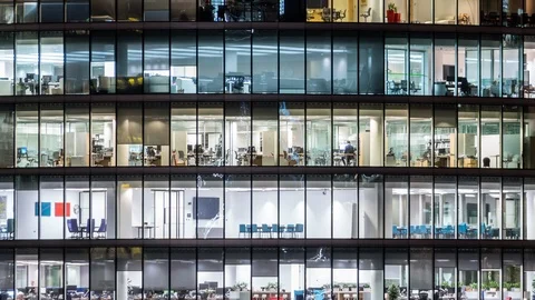 Night time Close up View Office Windows Skyscraper London City UK Time lapse Stock Footage 107092284