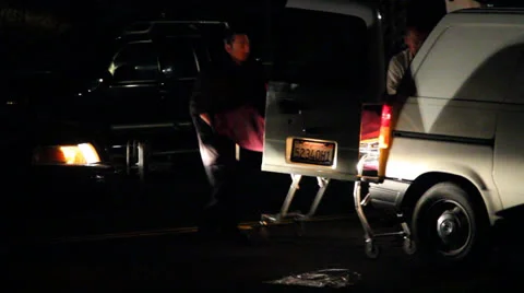 Night time Crime Scene Dead Body pushed into Coroners Van Stock Footage 22769804