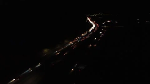 Night time freeway flyover lots of traffic Stock Footage 165569435
