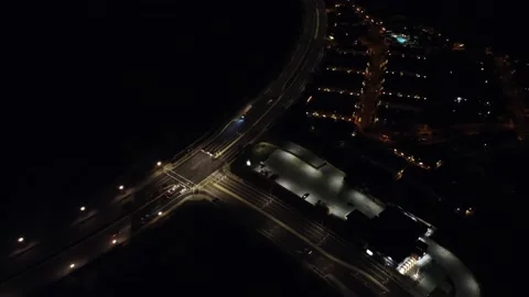 Night time intersection aerial flyover of highway and light traffic Stock Footage 218531953