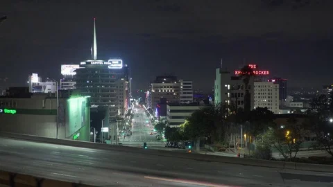 Night time-lapse of 101 freeway with hollywood capital records building Stock Footage 83146347