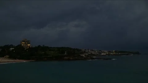 Night time lapse and powerful clouds over Coogee in Sydney 4K Stock Footage 329539884
