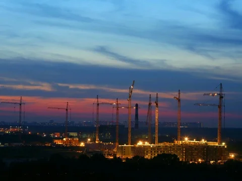 Night time lapse building construction with many cranes on horizon. Construction Stock Footage 79068468