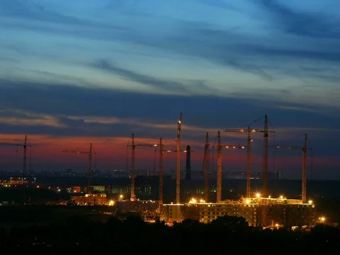 Night time lapse building construction with many cranes on horizon. Construction Video stock 79068495