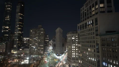 Night time-lapse of buildings across the street in the New York City Stock Footage 116600979