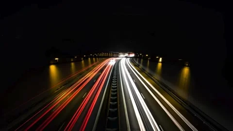Night Time Lapse of Car Lights Streaking Through Tunnel Dynamic Automotive .. Stock Footage 321948256