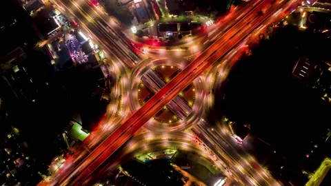 Night time-lapse of a city traffic aerial top view. Stock Footage